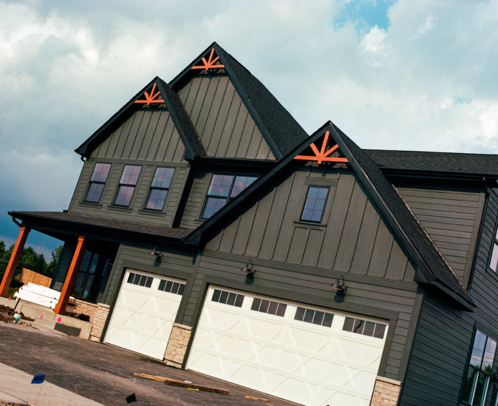 exterior painting on new residential construction by tbj