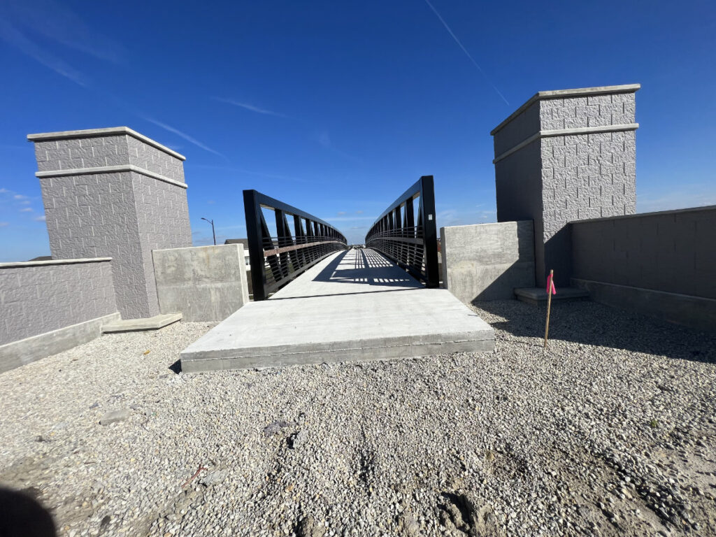 painted steel and concrete walking overpass 01